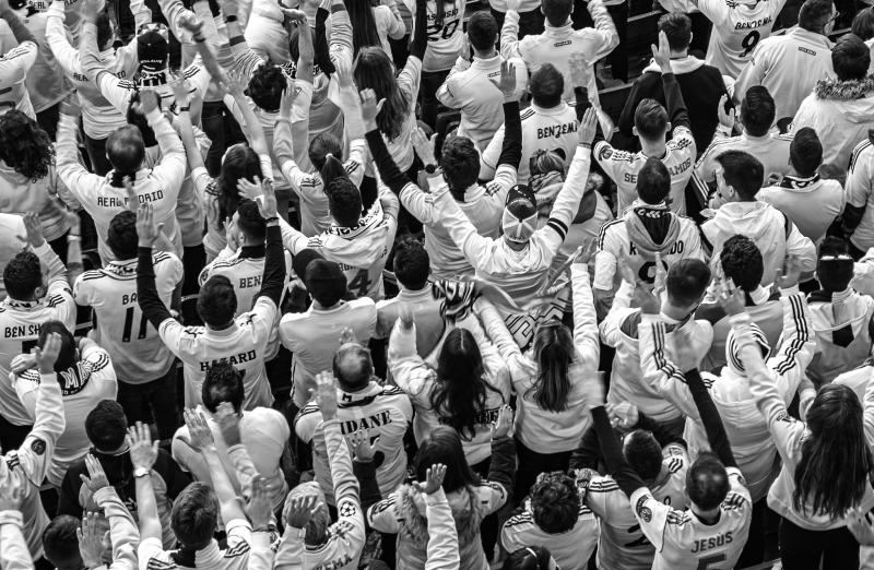 <p>Fans cheering for their club, Real Madrid at the Estadio Santiago Bernabéu, Madrid, Spain.</p>